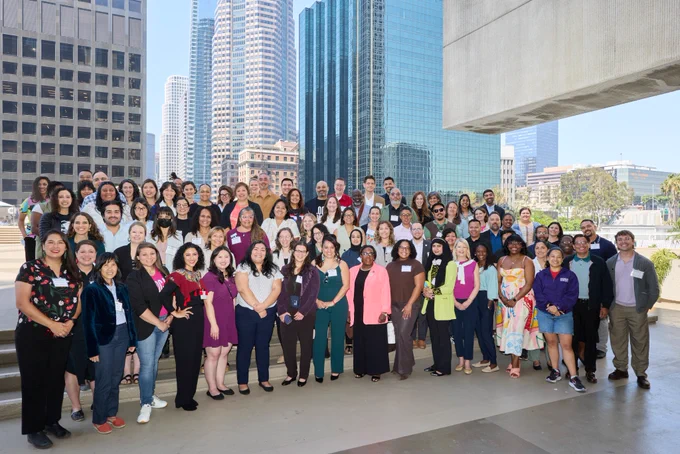 Group photograph of attendees at the Federal Deployments Convening in LA. Participants are lined up outside. 