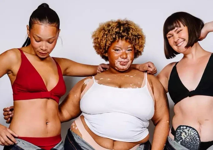 Three female models wearing bras 
