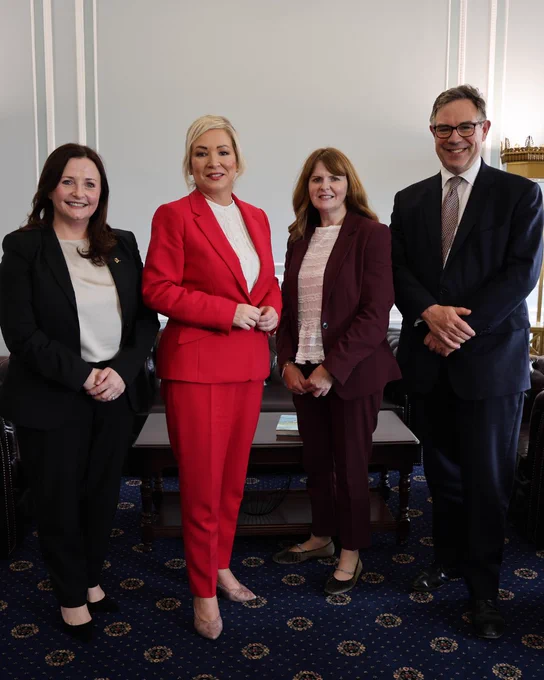 Four people - including First Minister Michelle O’Neill and Economy Minister Caoimhe Archibald - standing.