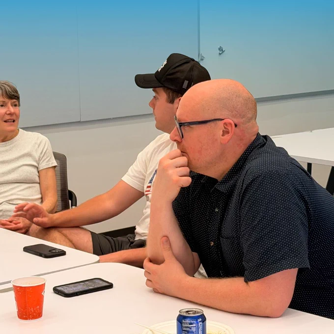 Summer Founders Program team members and Happy Valley LaunchBox Start-up consultant and Co-Working Manager Jason Huber sitting at table.