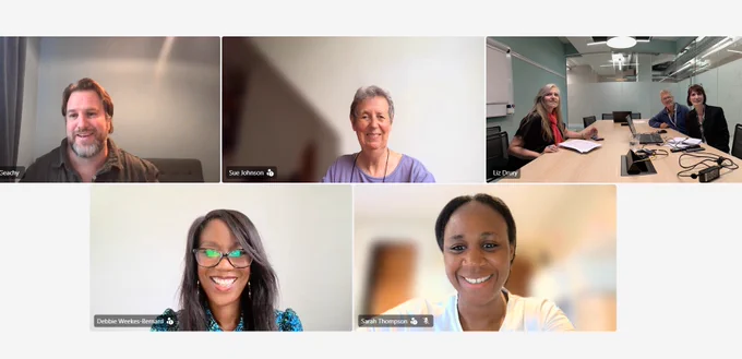 Seven people are looking and smiling at the camera. They are in five separate squares. One square on the top right has three people.