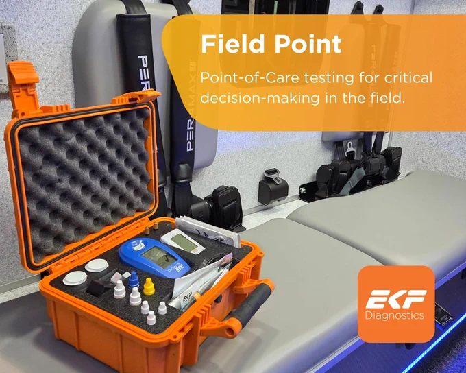 Portable orange diagnostic kit with various testing tools inside, set on a medical examination table in a clinical environment.