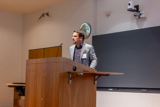 Marcus Smolka vice provost of research at Cornell Research & Innovation addresses the audience in Biotech G10 of Cornell University