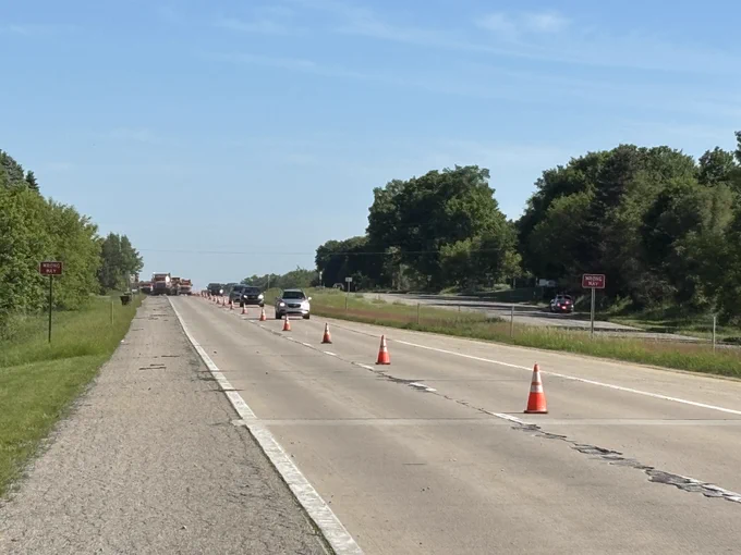 Motor vehicles driving through the construction zone