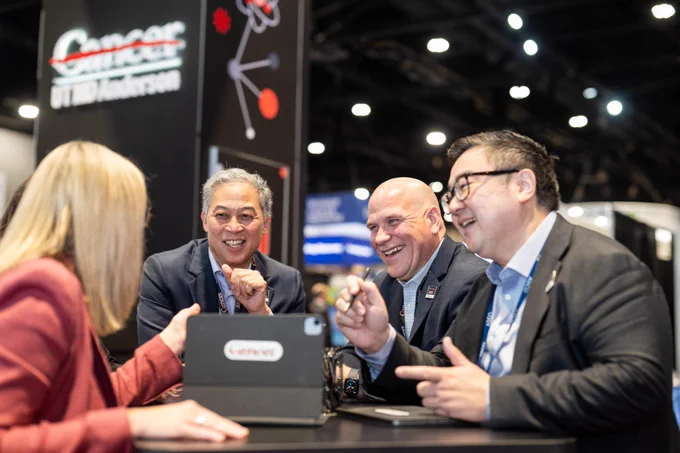 UT MD Anderson faculty at the booth.