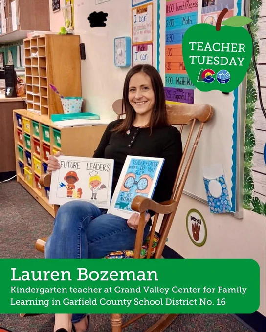 This image features a person seated in a classroom, holding two children's books titled "Future Leaders" and "Have You Filled a Bucket Today?". The classroom has educational decor on the walls and shelves. There is a green apple graphic in the corner with the text "Teacher Tuesday" and a caption about kindergarten teaching at Grand Valley Center for Family Learning in Garfield County School District No. 16.