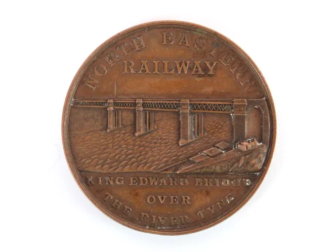 Coming to auction, a bronze medal coin by Elkington and Co commemorating the opening of the North Eastern Railway King Edward Bridge over the River Tyne, dated 1906.

4.7 cm diameter.

Image: Bentley's Auction Rooms