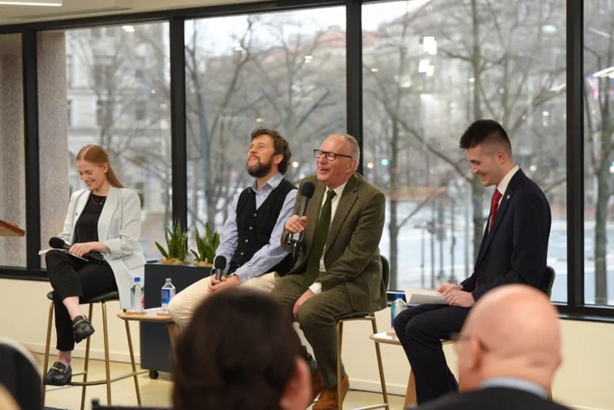 Washington Ireland Program alumni Aoife Joy Keogh, left, and Luke Teggert, right, moderate an event with "For and Against a United Ireland" authors Sam McBride and Fintan O'Toole at the University of Notre Dame's Washington Office.