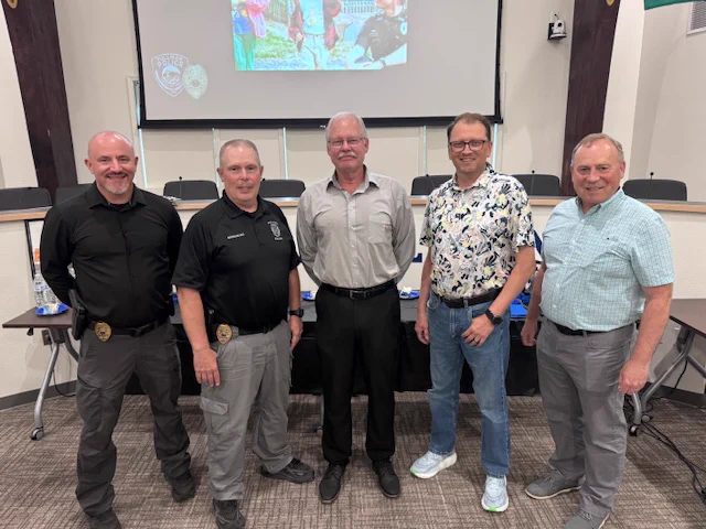 Commander Harris, Chief Breshears, Sergeant Umbright, City Administrator Wells, and Mayor Benjamin.
