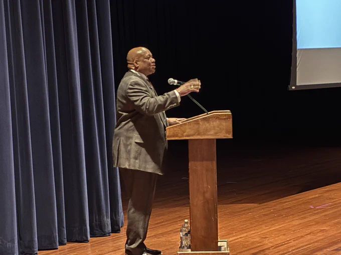 Dr. Yearwood speaks at a podium.