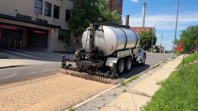 Crews apply Reclamite treatments to South Fifth Street, June 2, 2026.