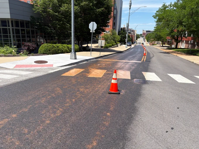 Crews apply Reclamite to South Fifth Street, June 2, 2026.