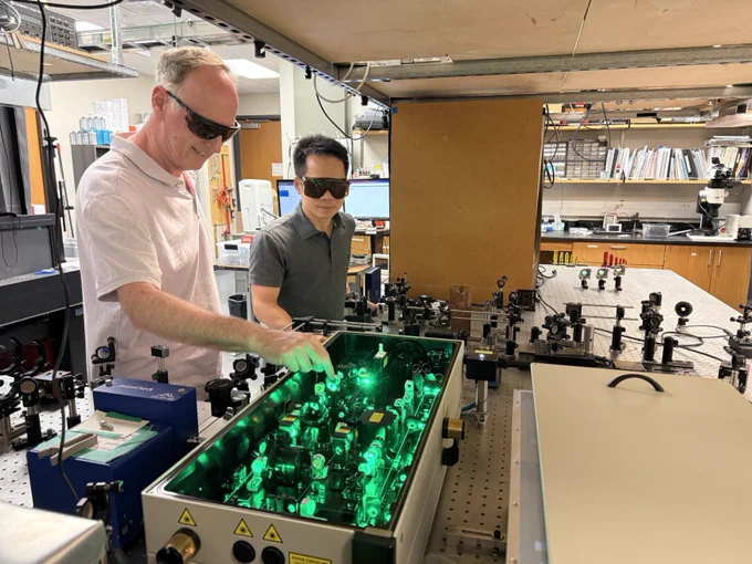 Two people working in a lab.