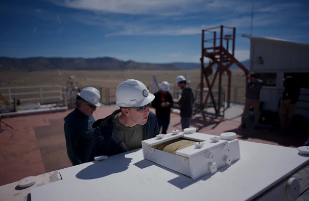 Lockheed Martin engineer Derek Shannon evaluates samples of thermal protection material for the Dragonfly heat shield before testing at Sandia National Labs’ Solar Thermal Test Facility in Albuquerque, New Mexico. (Credit: NASA)