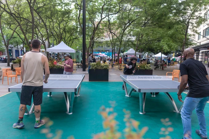 Four people play ping-pong at Westlake Park