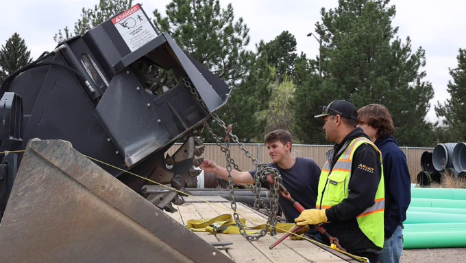 High school students explore utilities field equipment