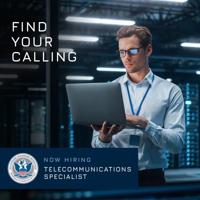 Business professional gentlemen standing and holding a laptop. Text reads, Find your calling. Now hiring. Telecommunications Specialist.