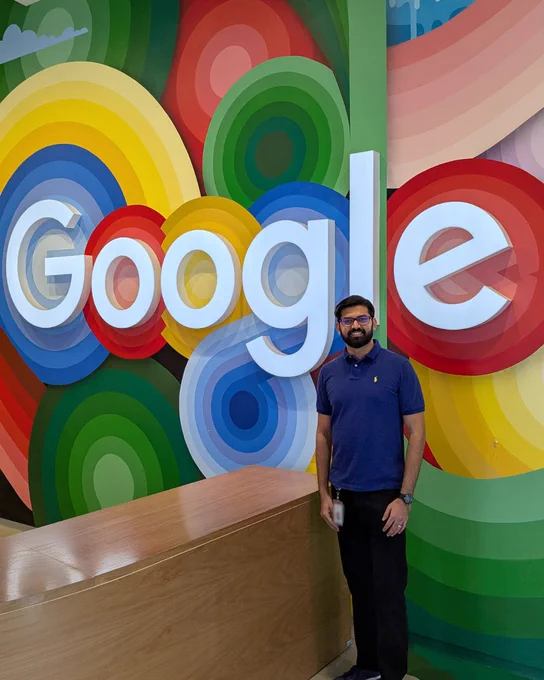Samrat in front of Google logo
