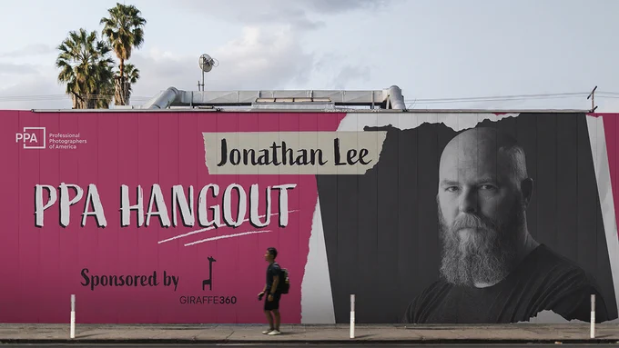 A large billboard displays the "PPA Hangout" with an image of an individual. The event is sponsored by Giraffe360. The background features palm trees and a cloudy sky.