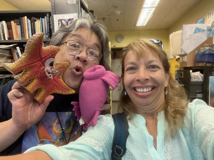 Chris Mah and Chris Kellogg take a selfie in his office