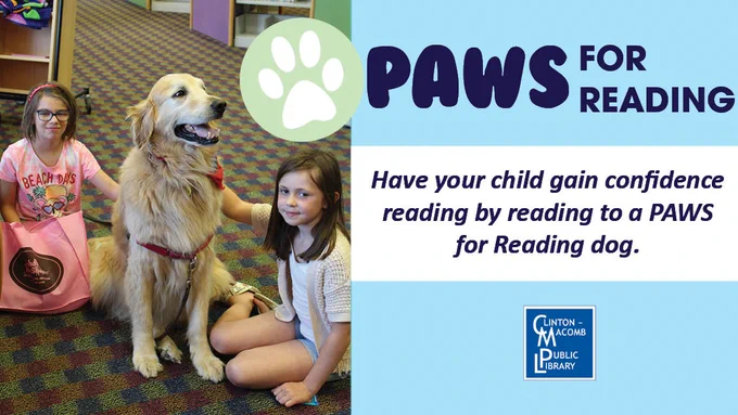 Two children sitting on the floor with a calm golden retriever participating in a PAWS for Reading program at a library.