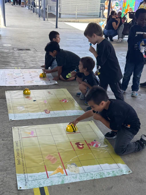 Students from 186th Street Elementary School playing robotics activity