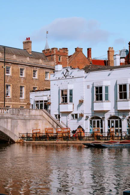 Scenic view of the Anchor pub by River Cam in Cambridge, England, showcasing historic architecture.