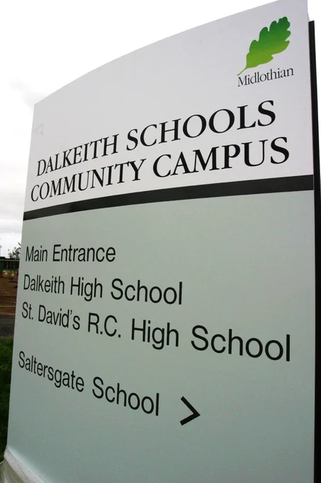 Signboard for Dalkeith Schools Community Campus listing main entrance and three schools: Dalkeith High, St. David's R.C. High, and Saltersgate School.
