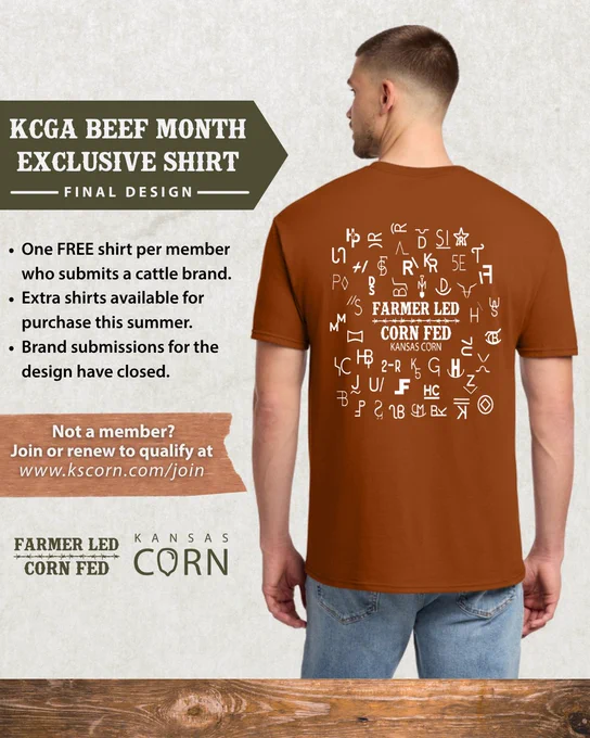 Man wearing a brown Kansas Corn Beef Month shirt featuring cattle brand symbols and text promoting farmer-led, corn-fed beef.