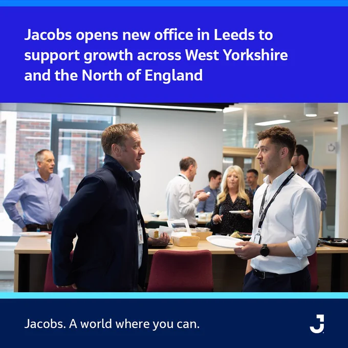 Employees gather and converse in the new Jacobs office in Leeds, fostering collaboration to support regional growth in West Yorkshire and Northern England.
