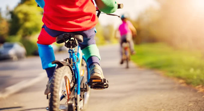 An image of two children cycling