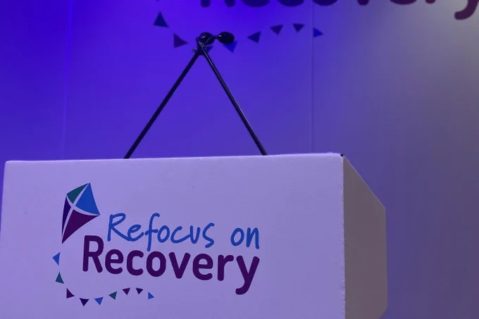 Lectern with Refocus on Recovery branding