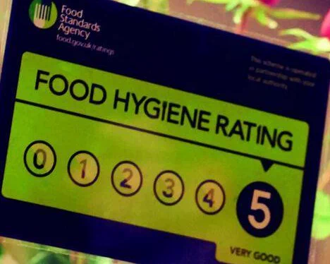 This is a Food Hygiene Rating sticker from the UK Food Standards Agency (FSA).The rating shown is a 5, which signifies the establishment's hygiene standards are "Very Good".