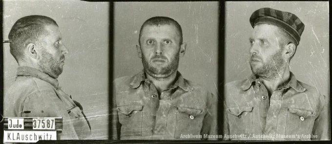 A mugshot registration photograph from Auschwitz. A man with a shaved head wearing a striped uniform photographed in three positions (profile and front with bare head and a photo with a slightly turned head with a hat on). The prisoner number is visible on a marking board on the left.
