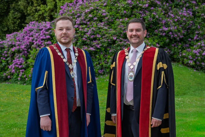 Two men in Mayoral robes and chains of office.