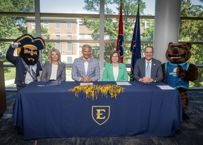 ETSU's mascot Bucky and Northeast State Community College's mascot Bear with Dr. Kimberly D. McCorkle, Dr. Brian Noland, Dr. Connie Marshall, and Dr. Jeff McCord at the Bears to Bucs signing.