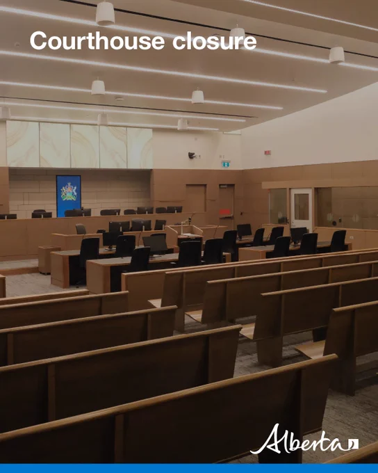 Empty courtroom with rows of benches facing the judge’s bench. Text reads ‘Courthouse closure.’ Alberta logo in the lower right.