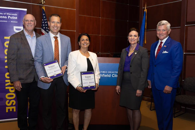Pictured at the UW Regents Business Partnership Award ceremony is UW Regent Jack Salzwedel, President and CEO of Marshfield Clinic Dr. Brian Hoerneman, Interim UWSP Chancellor Pratima Gandhi, Interim UW President Renée Wachter and Chair of the Marshfield Clinic Regional Board of Directors Dick Leinenkugel.
