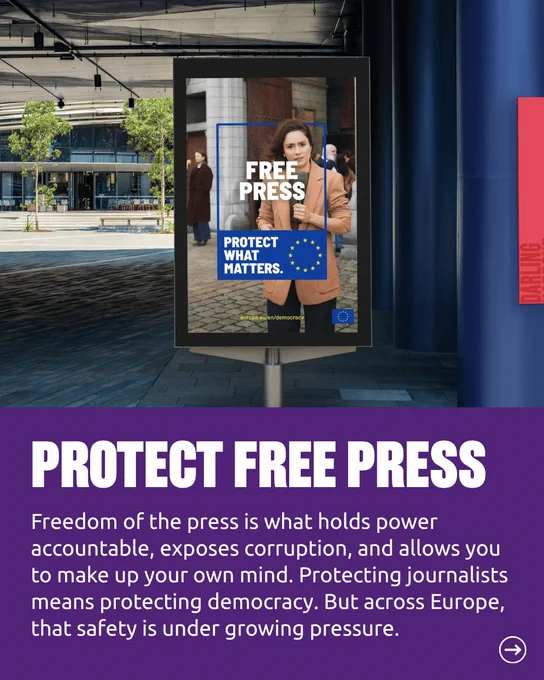 The Free Press advertisement is shown again on a standing display panel in an open urban plaza. Below it, a purple panel with the heading Protect Free Press explains that freedom of the press holds power accountable, exposes corruption, and lets people make up their own minds, that protecting journalists means protecting democracy, and that across Europe this safety is under growing pressure.