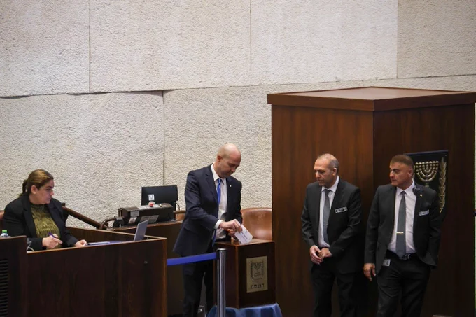 Speaker of the Knesset MK Amir Ohana casting a ballot in the Knesset Plenum