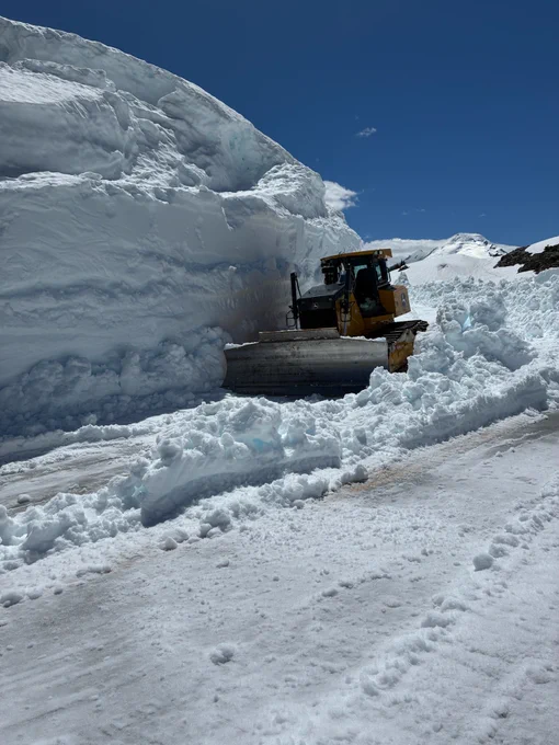 A bulldozer works to clear snow from the roadway on SR 542/Mt. Baker Highway on the road to Artist Point.