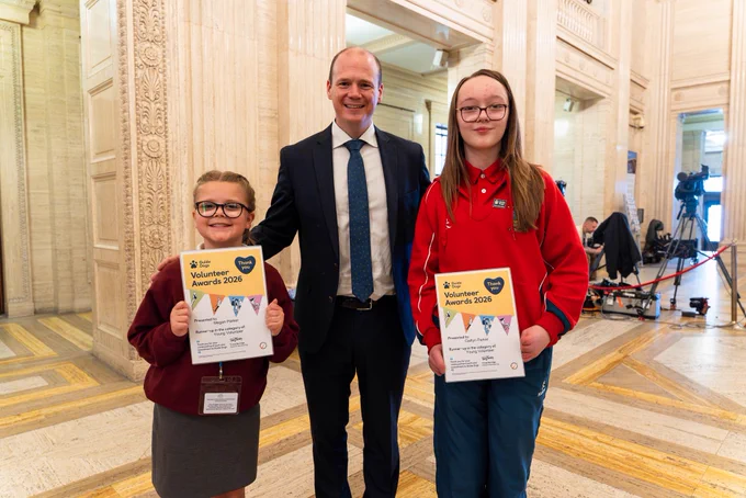 Minister Lyons pictured with Guide Dogs NI volunteers