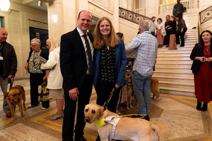 Minister Lyons pictured with Brook, a guide dog
