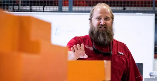 Travis Hunsucker probably giving a talk or addressing students