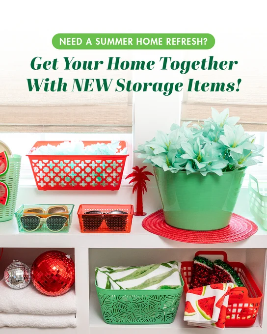Bright red and green storage baskets holding sunglasses and towels, arranged on white shelves with decorative summer items. Text says 
"Get Your Home Together With NEW Storage Items!"