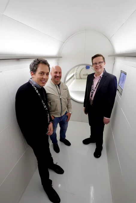 Ben Nedivi, Matt Wolpert, and Garrett Reisman pose for a photo together at Vast Space Station.