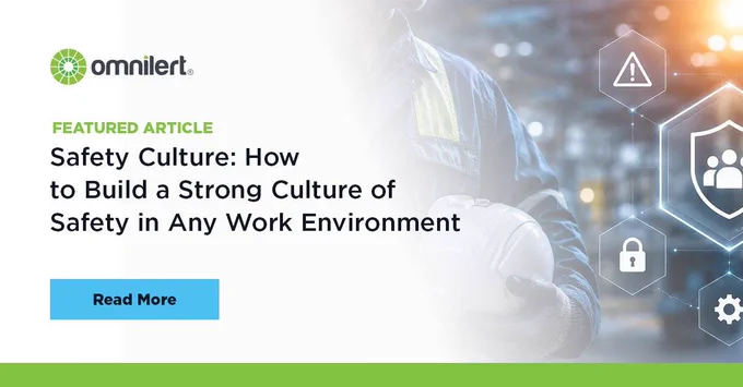 A graphic. The left half is white and fades into an image of a construction worker's arm holding a hard hat, with futuristic icons indicating different safety culture factors to the right. On the white half, in small green text it says "Featured Article," and below it, in larger black font "Safety Culture: How to Build a Strong Culture of Safety in Any Work Environment." Above the text is the Omnilert logo, and below it is a non-clickable button that says "Read More."