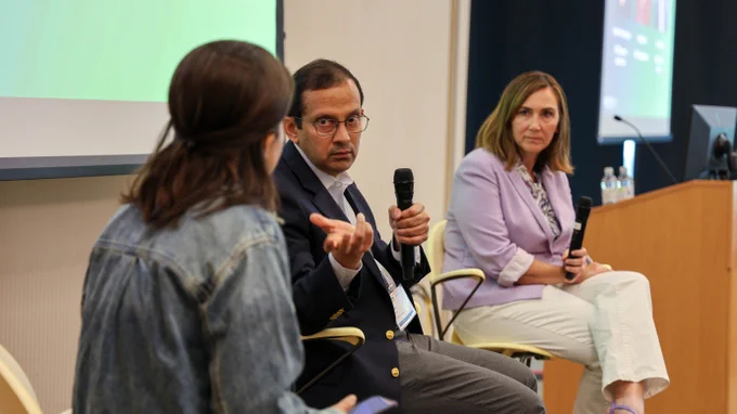 Arjun Shankar responds to a question during a fireside chat while Verónica Melesse Vergara and Ashley Barker listen.