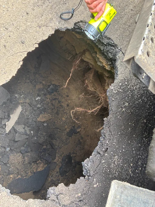 Sinkhole on SW Dosch Road between SW Newby Terrace and SW Hamilton Street due to an active sinkhole approximately 15' wide x 12' long x 12' deep.