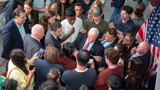 A crowd surrounds Mike Pence in the Forum.